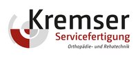 Logo der Kremser Servicefertigung mit rotem und grauem Kreiselement 